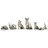Six miniature silver animals comprising three cats, tortoise, snail and dog, the largest 4cm high,