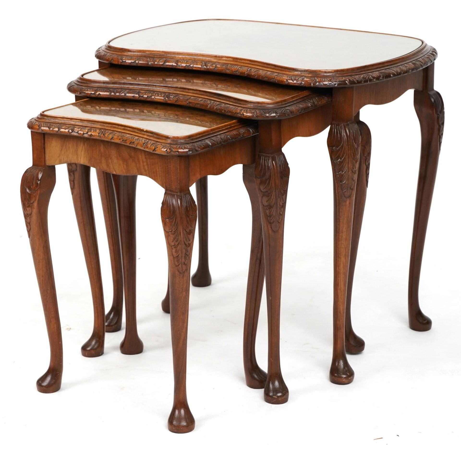 Nest of three burr walnut kidney shaped occasional tables with glass tops, the largest 57cm H x 60cm