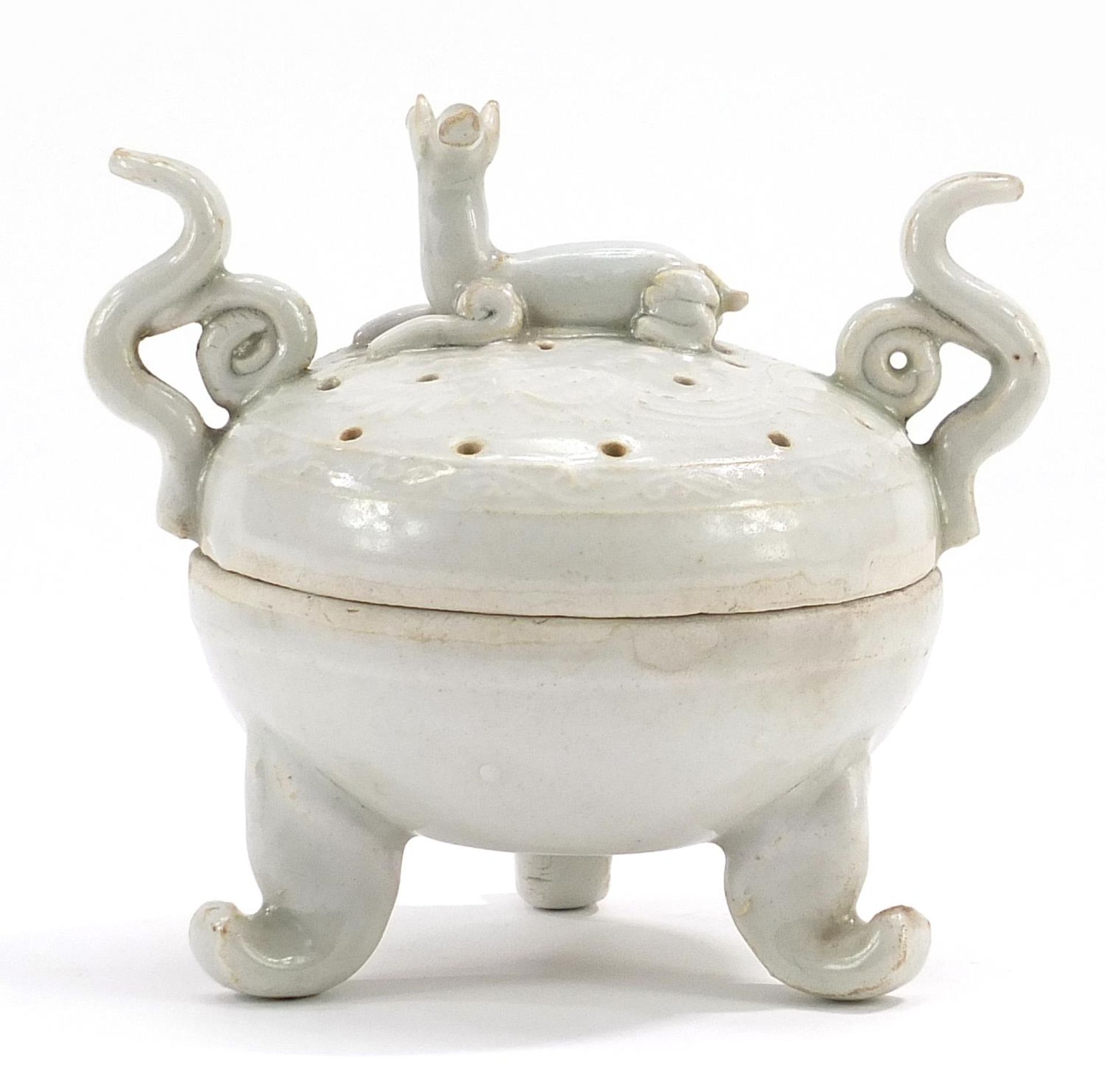Chinese porcelain tripod censer and cover with twin handles and animal knop having a celadon