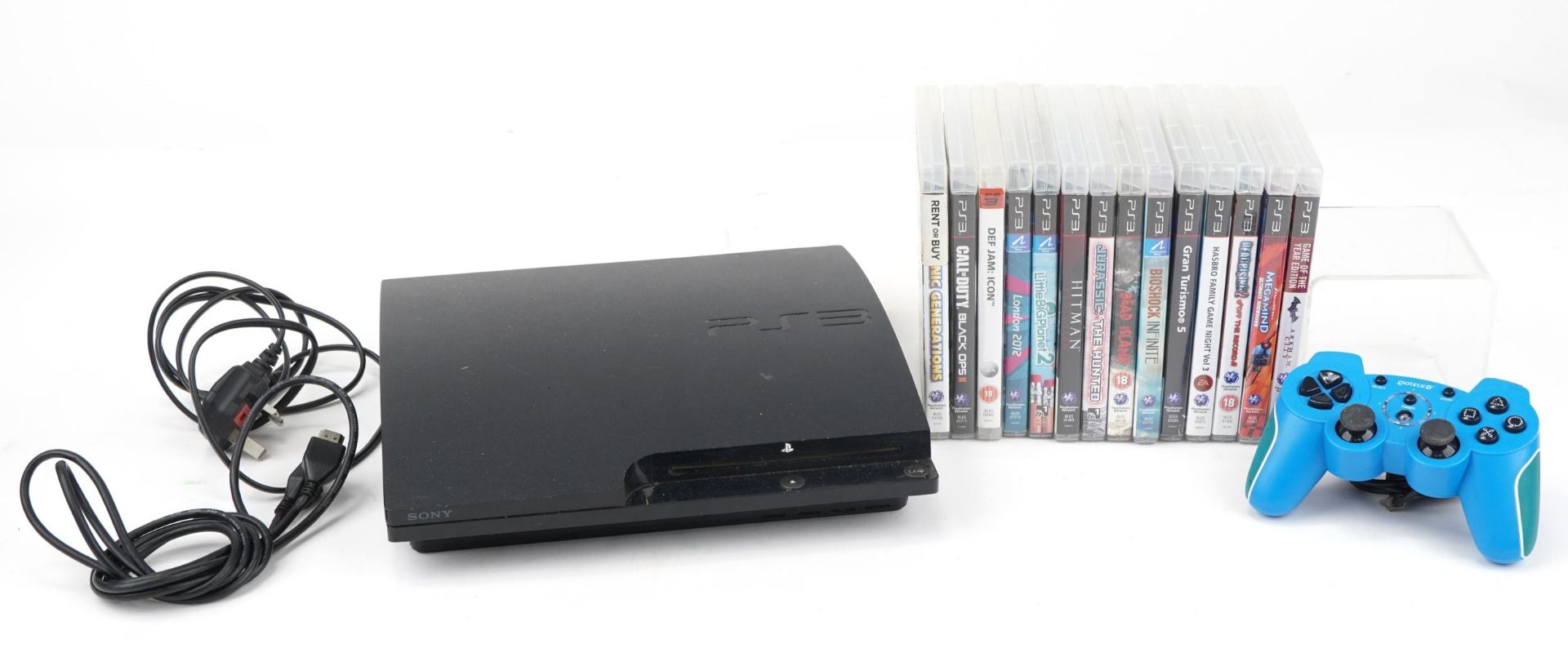 Sony PlayStation 3 games console with controller and a collection of games