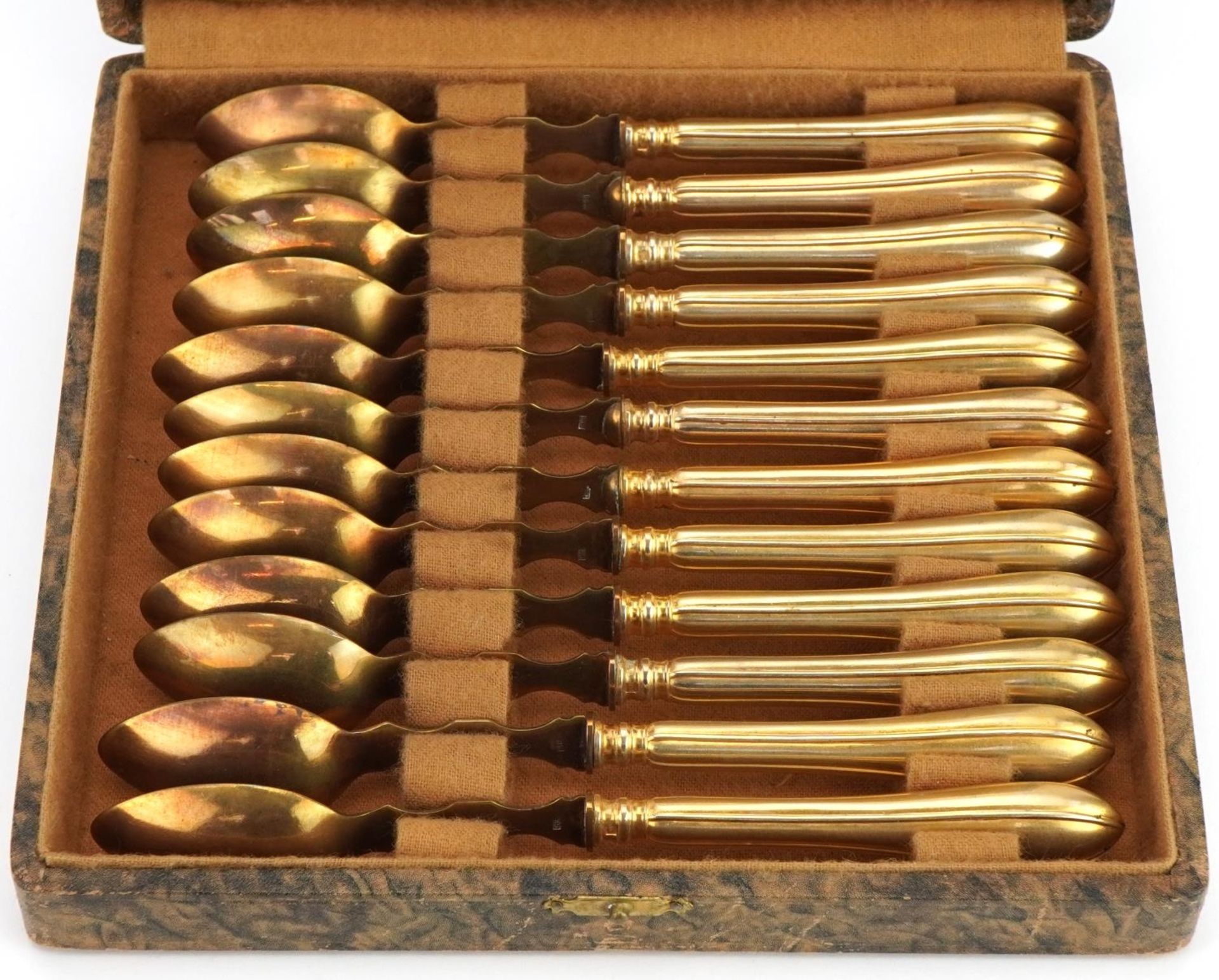 Set of twelve gilt metal spoons impressed THEO housed in a fitted case, 16.5cm in length - Image 2 of 6