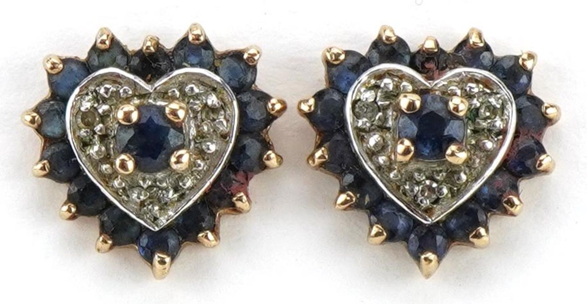 Pair of 9ct gold diamond and sapphire love heart stud earrings, 1.0cm high, 1.7g