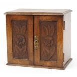 Art Nouveau oak smoker's cabinet with lift up top enclosing three drawers