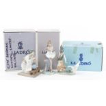 Three Lladro porcelain figurines with boxes including a Geisha girl with a vase of flowers, the