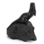 Inuit interest stone carving of an otter, indistinctly signed, 19cm high