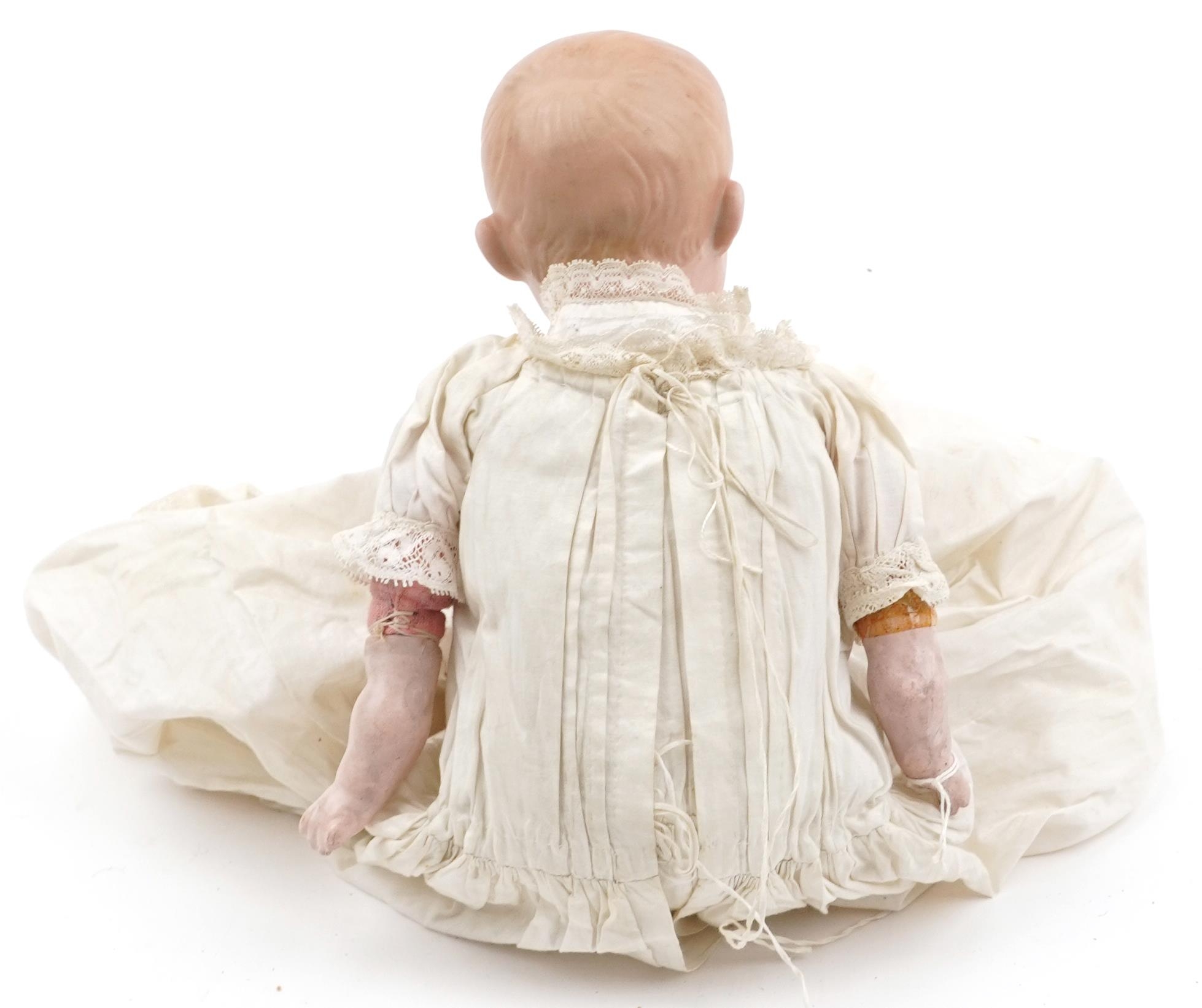 Armand Marseille, antique German bisque headed baby doll in a christening gown impressed 600A2M D. - Image 2 of 4