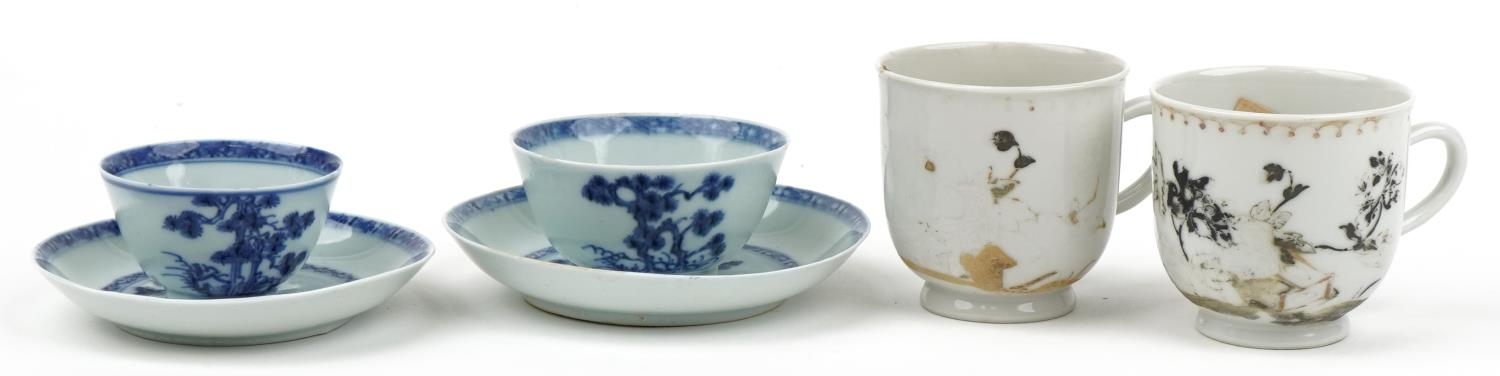 Chinese blue and white porcelain from the Nanking Cargo comprising two tea bowls with saucers and