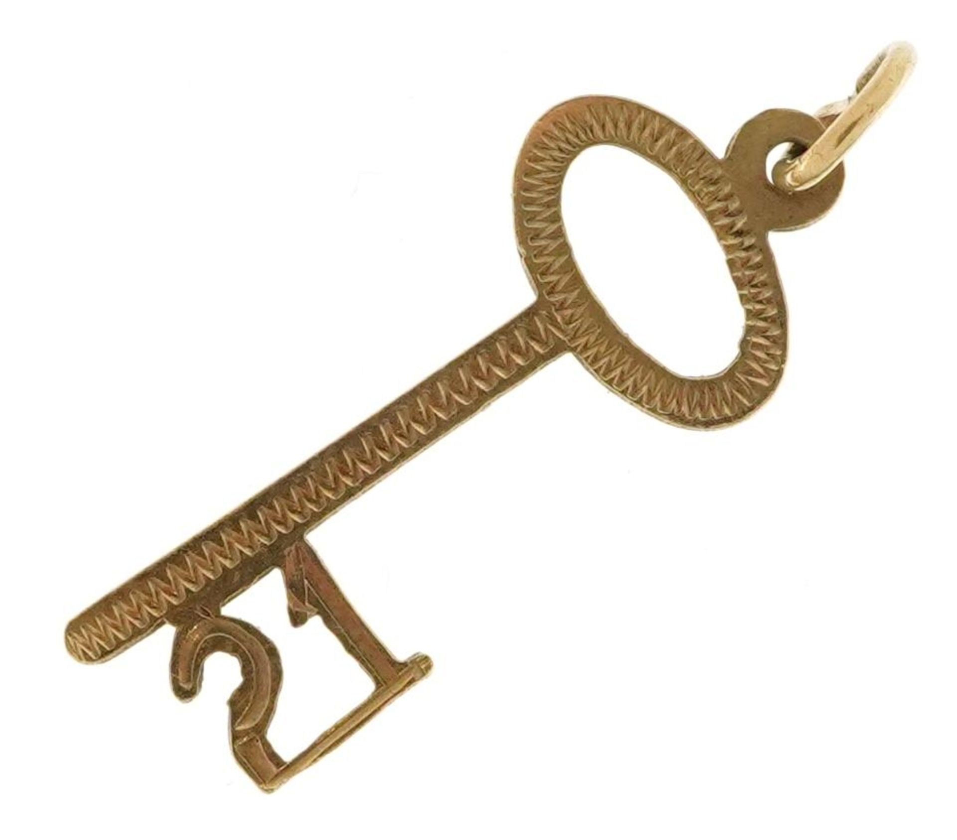 9ct gold 21 key charm, 2.5cm high, 0.6g