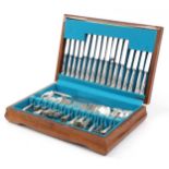 Silver plated cutlery housed in a mahogany canteen, the knives engraved Black & Barlow Sheffield,