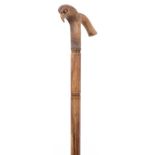 Hardwood walking stick with carved bird design handle