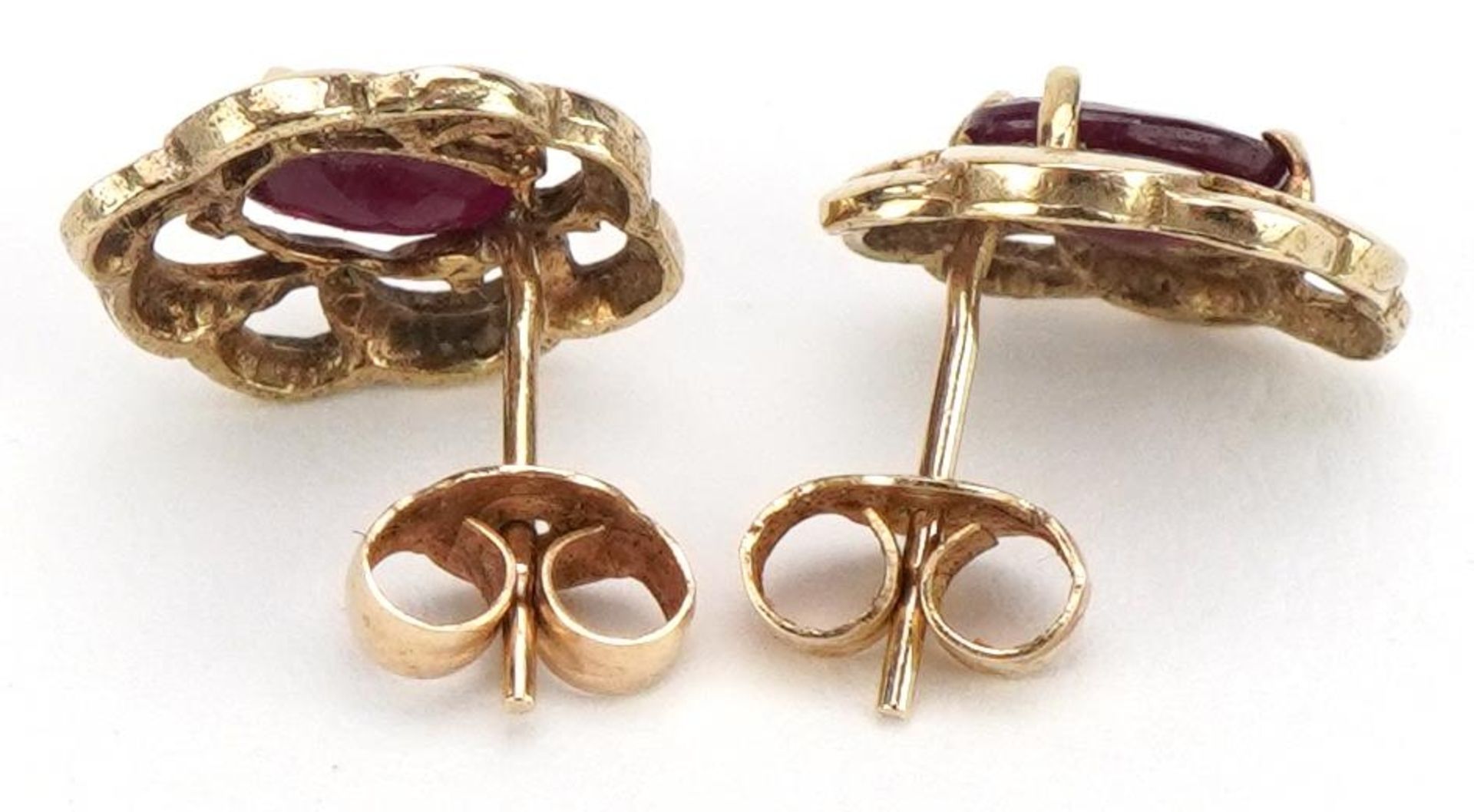 Pair of unmarked gold ruby stud earrings, the butterflies marked 9ct, 1.1cm high, 1.1g - Image 2 of 2