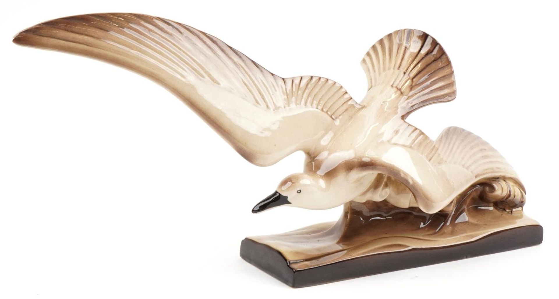 Art Deco style pottery sculpture in the form of a stylised gull, 74cm in length