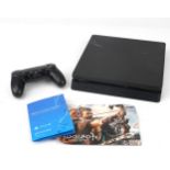 Sony PlayStation 4 games console with controller