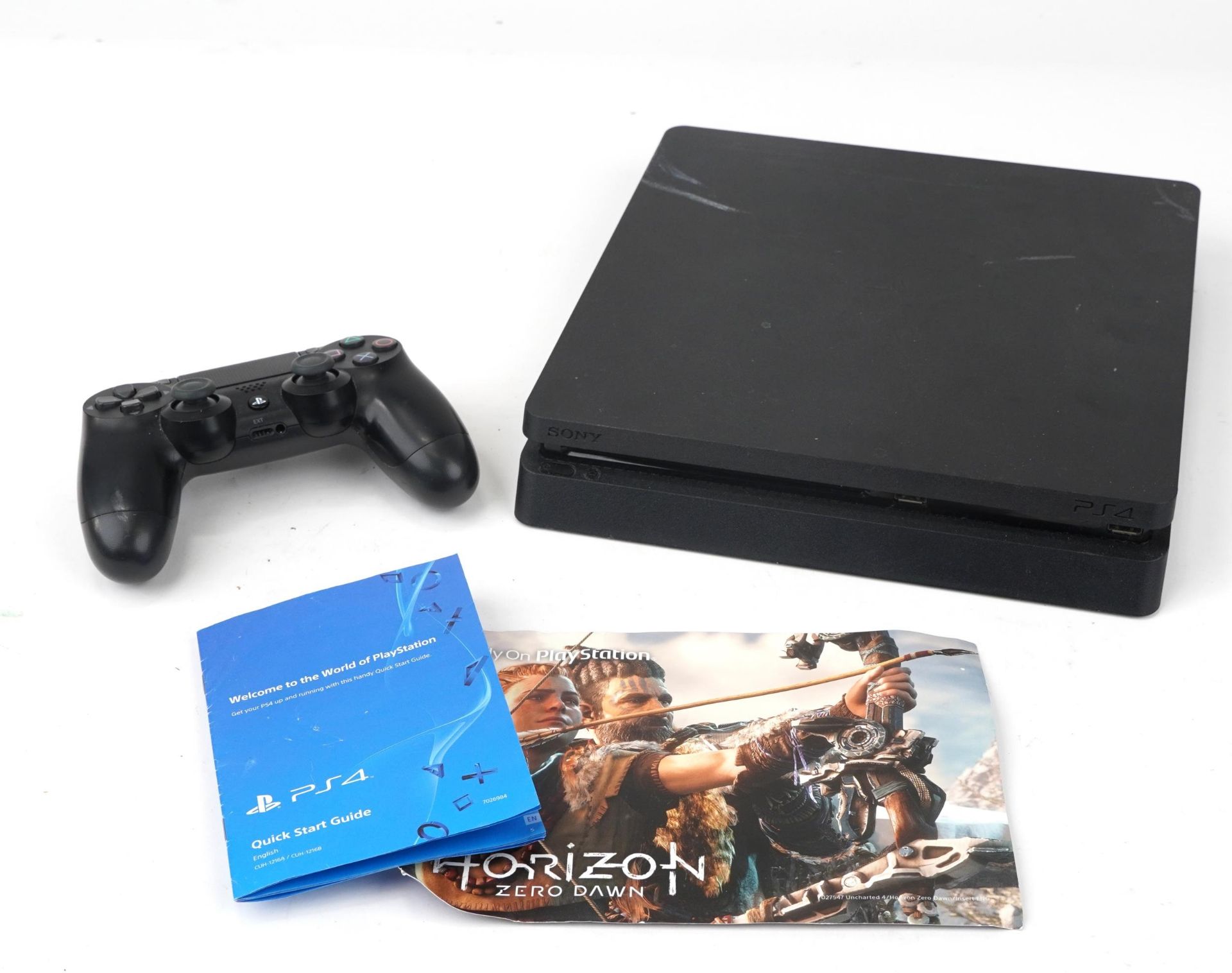 Sony PlayStation 4 games console with controller