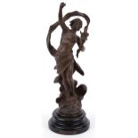 Patinated spelter study of a nude male holding a flaming torch raised on a circular ebonised base