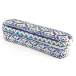 Turkish Iznik pottery pen box and cover, 23.5cm in length
