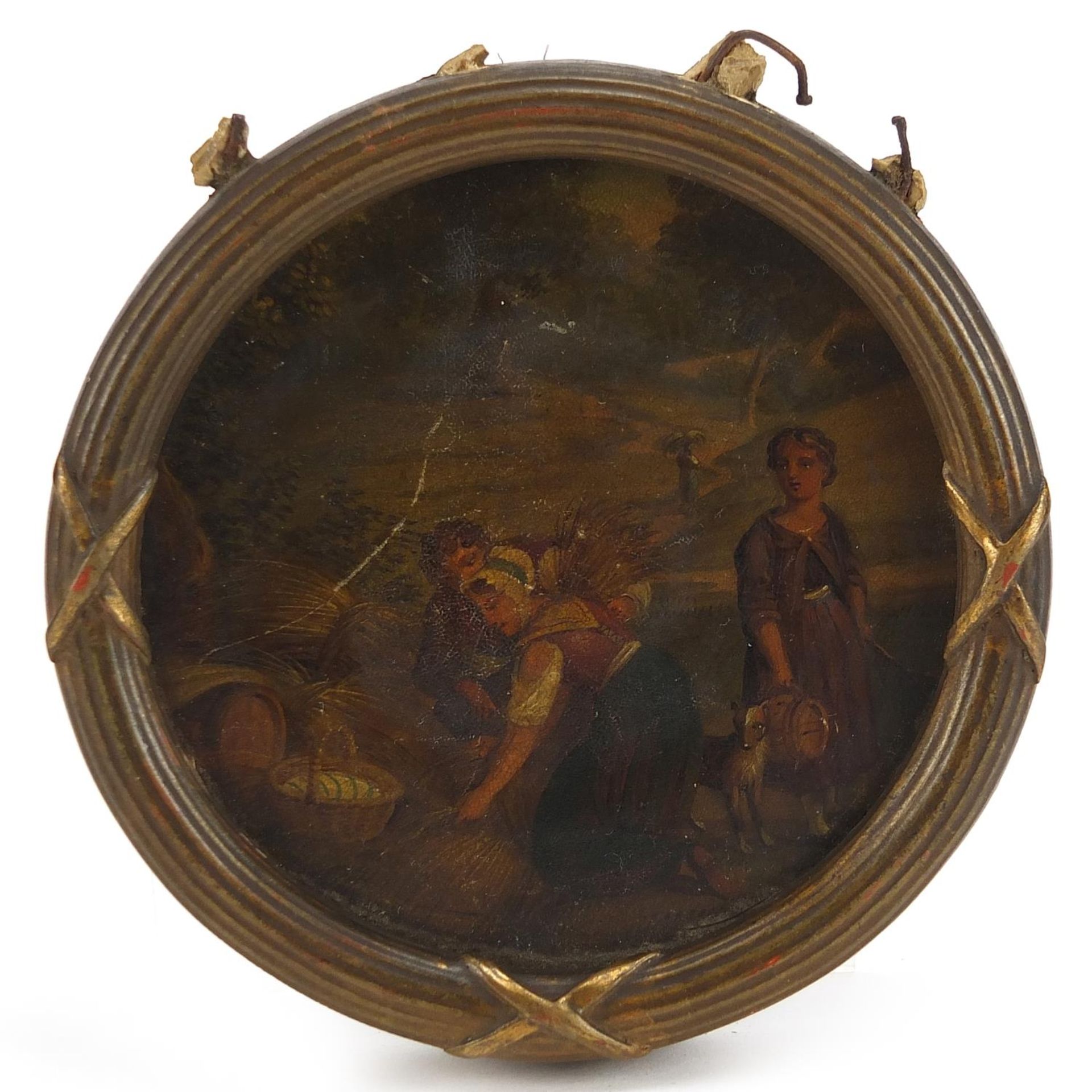 Circular miniature of three figures haymaking with dog, housed in a gilt frame, 8.5cm in diameter