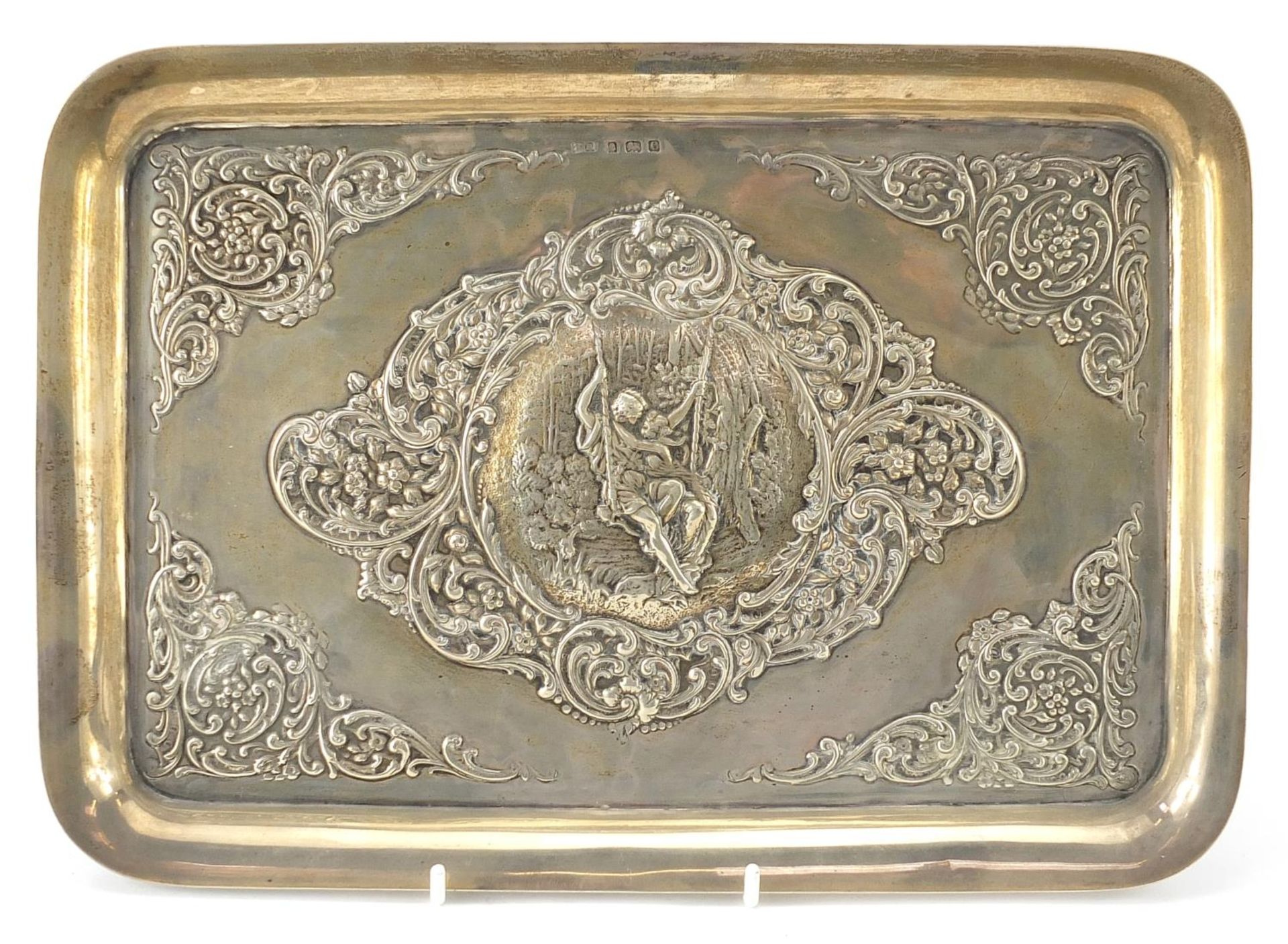 Henry Matthews, Art Nouveau rectangular silver tray embossed with a courting couple on a swing,