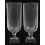 Pair of Regency style cut glass celery vases, each 40cm high