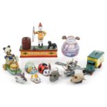 Vintage and later toys including clockwork animals and a hand painted cast iron trick dog moneybox,