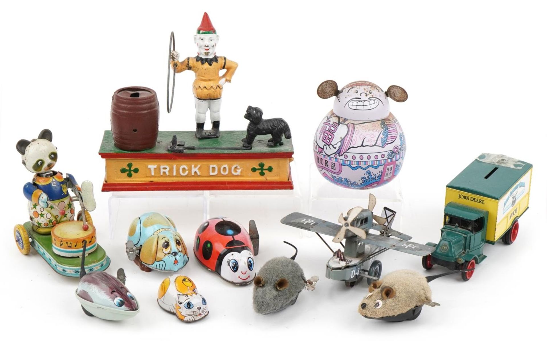 Vintage and later toys including clockwork animals and a hand painted cast iron trick dog moneybox,