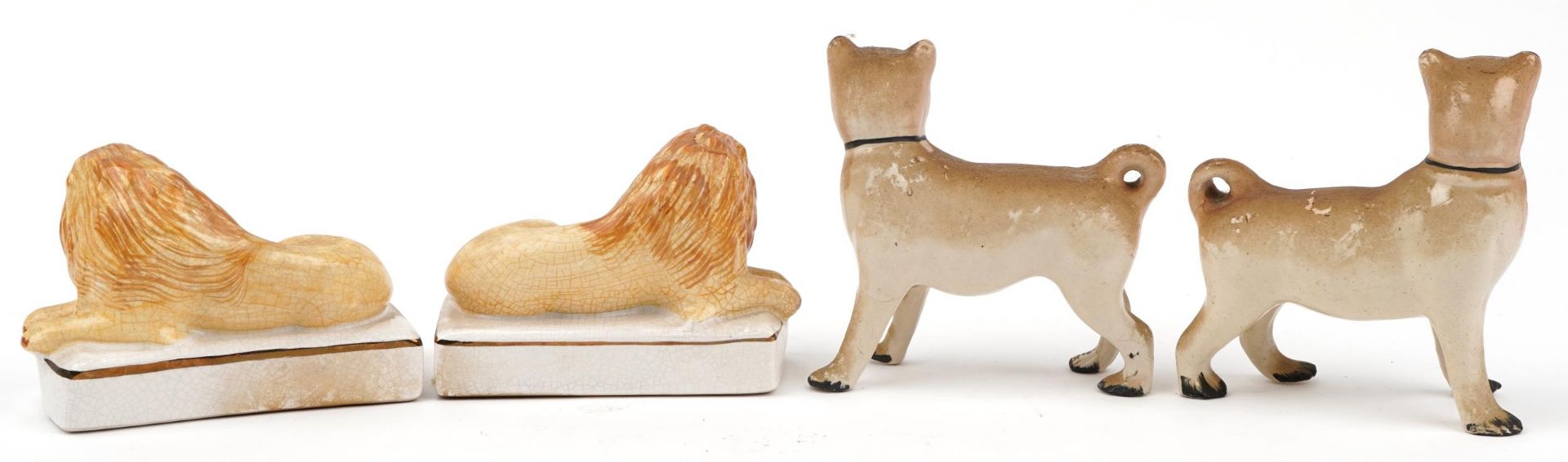 Pair of Staffordshire style dogs and a similar pair of recumbent lions, each 14.5cm wide - Image 2 of 4