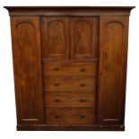 Victorian mahogany compactum wardrobe with two doors and two central cupboard doors above four