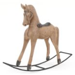 Carved wood doll's rocking horse, 60cm in length x 50cm high