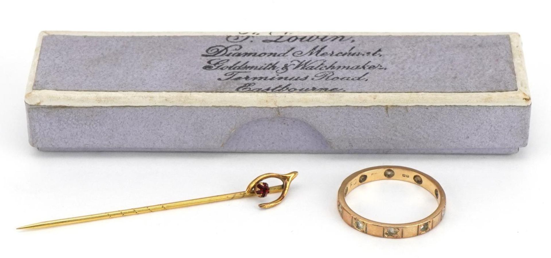 9ct gold clear stone eternity ring and an unmarked gold wishbone stickpin set with a red stone, - Image 2 of 4