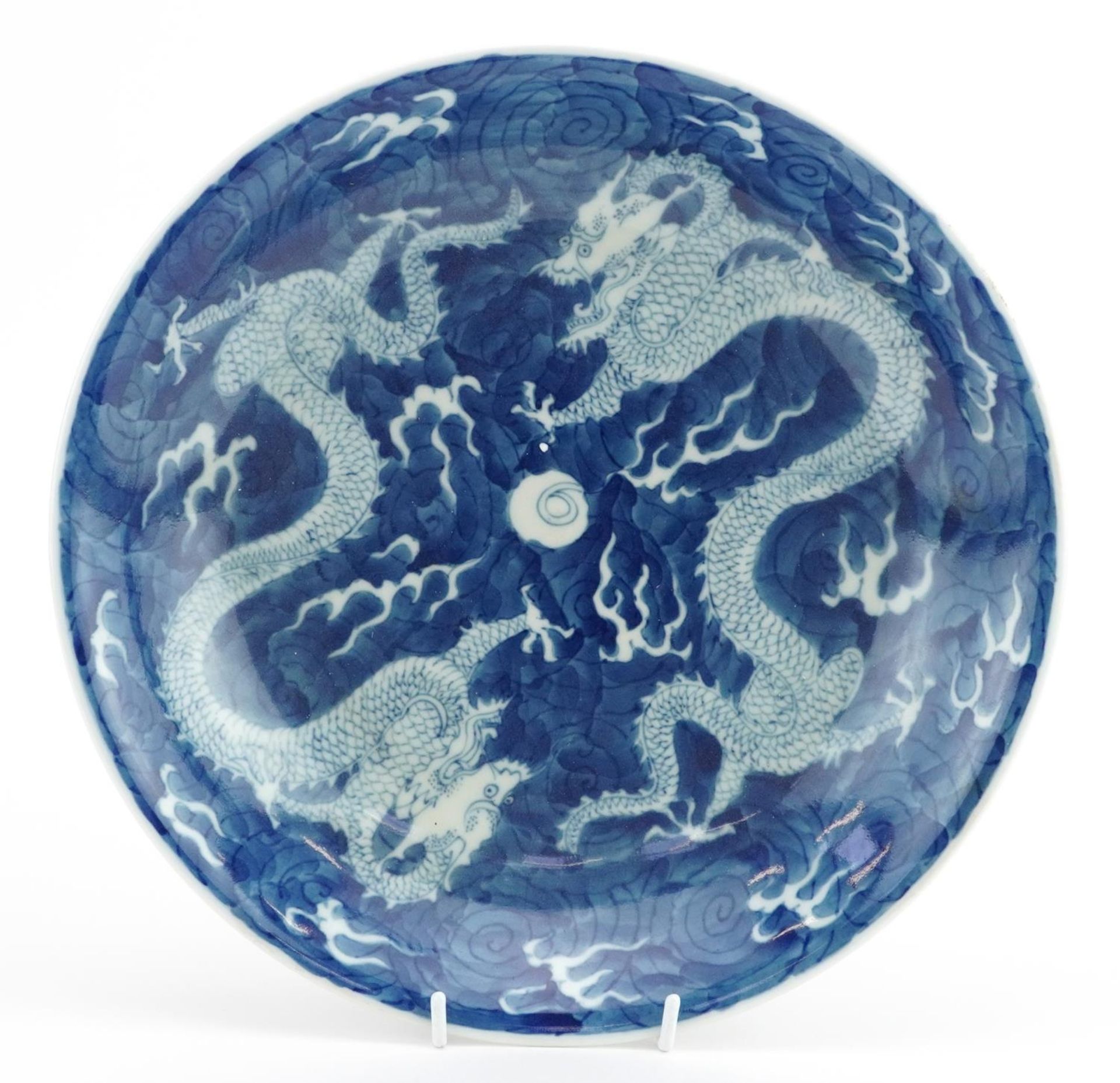 Chinese blue and white porcelain shallow bowl hand painted with dragons chasing the flaming pearl