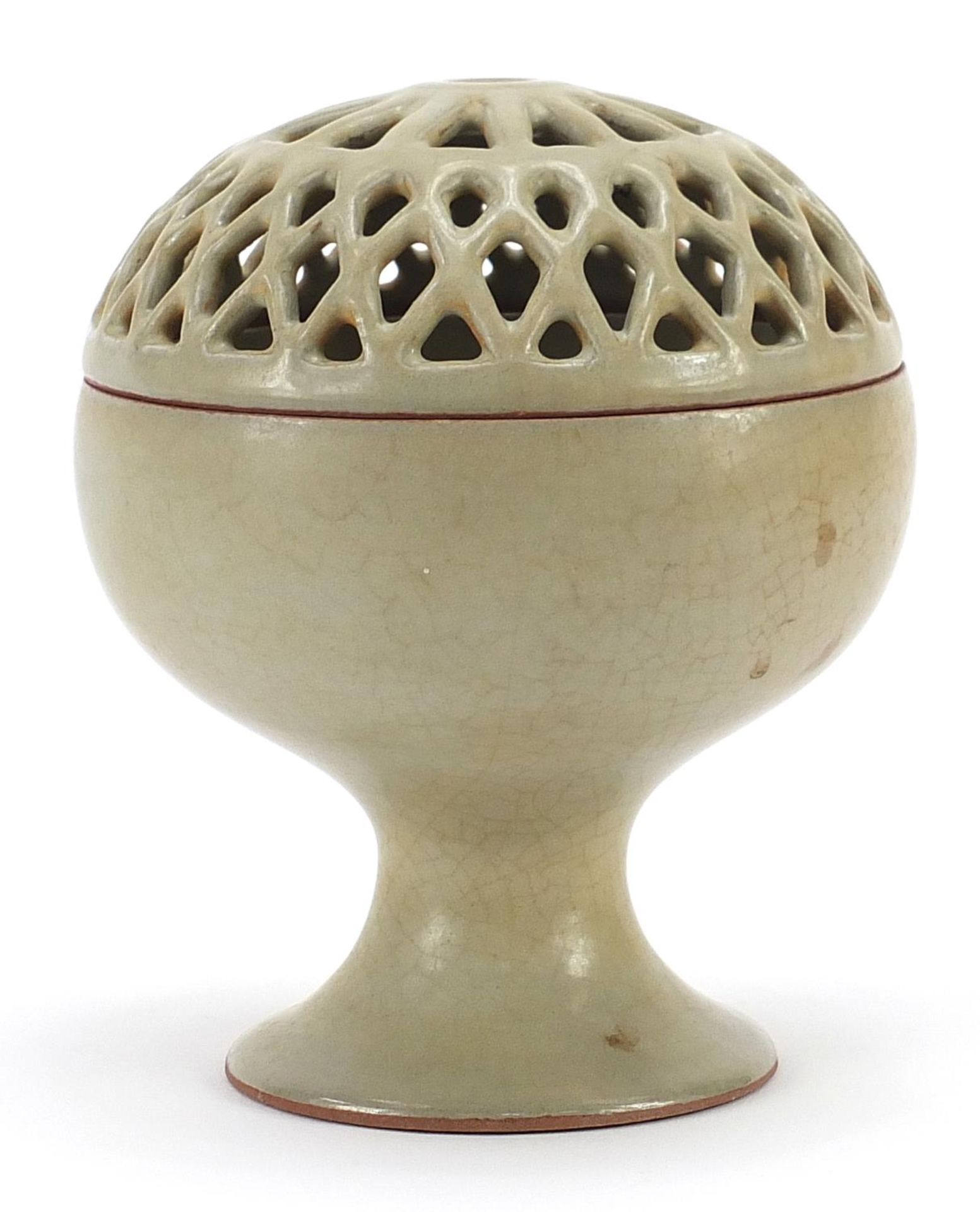 Chinese porcelain pedestal bowl with pierced cover having a celadon glaze, 15.5cm high