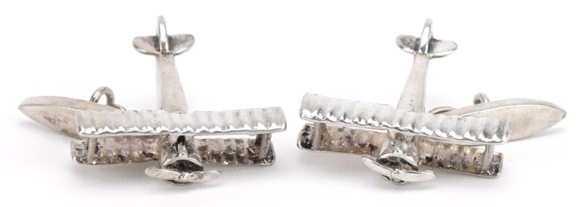 Martick, pair of silver cufflinks in the form of bi-planes, 2.6cm wide, 10.8g