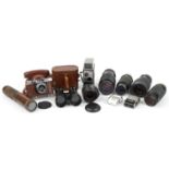 Vintage and later cameras, lenses, binoculars and brass three draw telescope including Bell &