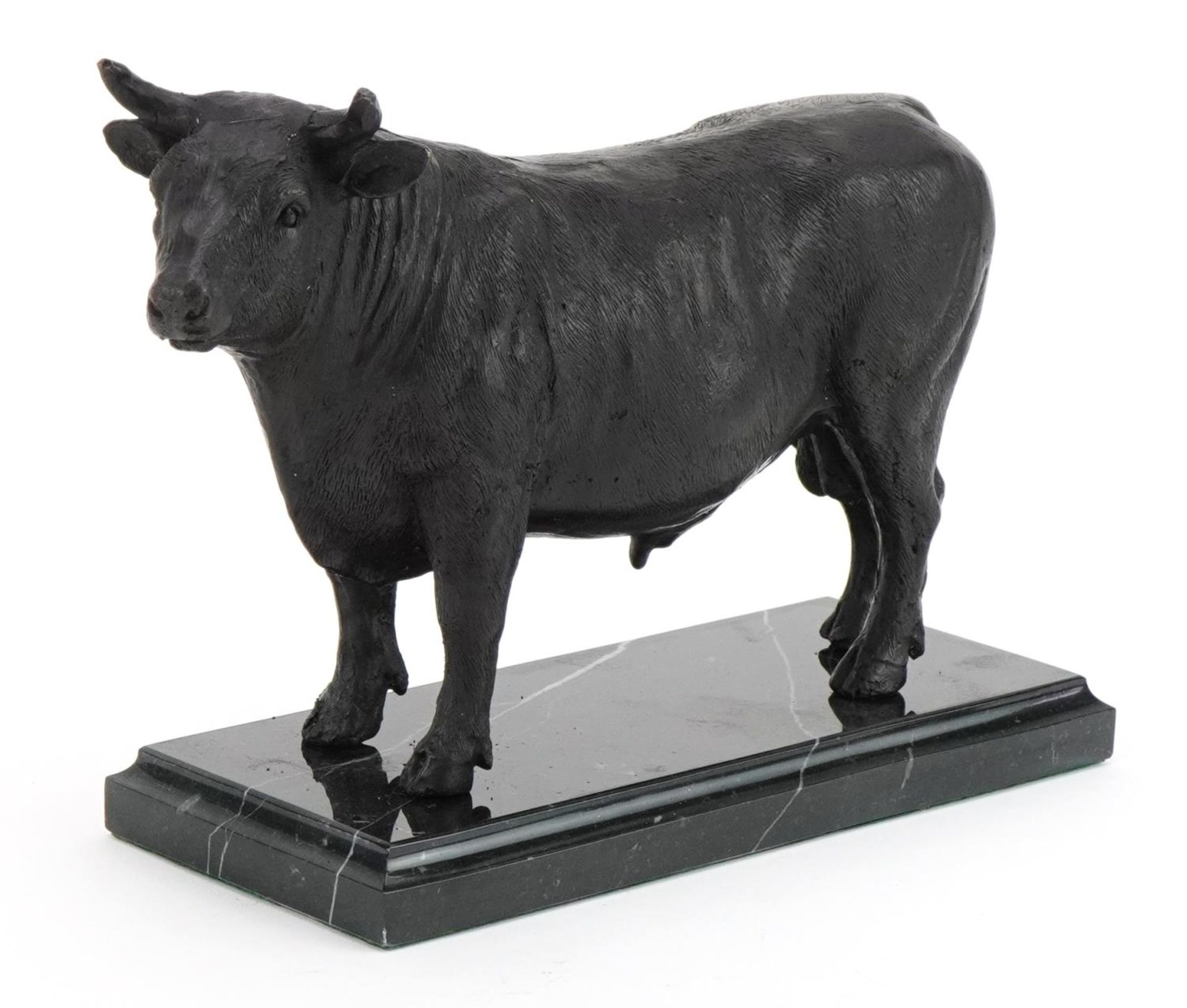 Bronze study of a bull raised on a rectangular marble base, 25cm wide