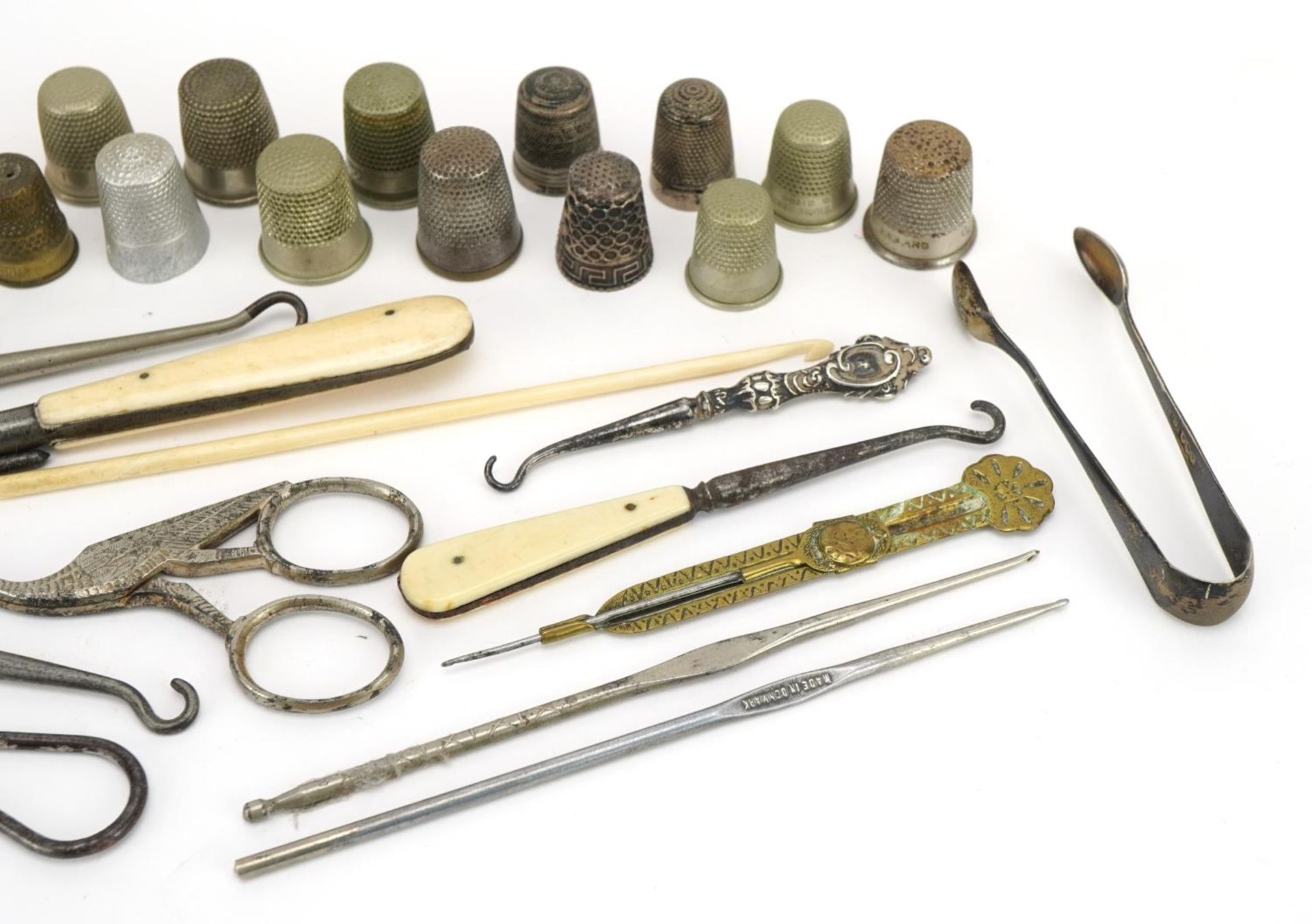 Victorian and later sewing objects including silver thimbles, bone handled button hooks and - Image 3 of 3