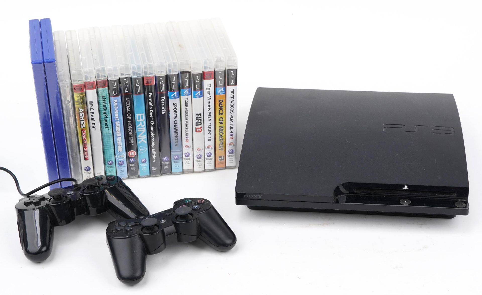 Sony PlayStation 3 games console with controllers and collection of games