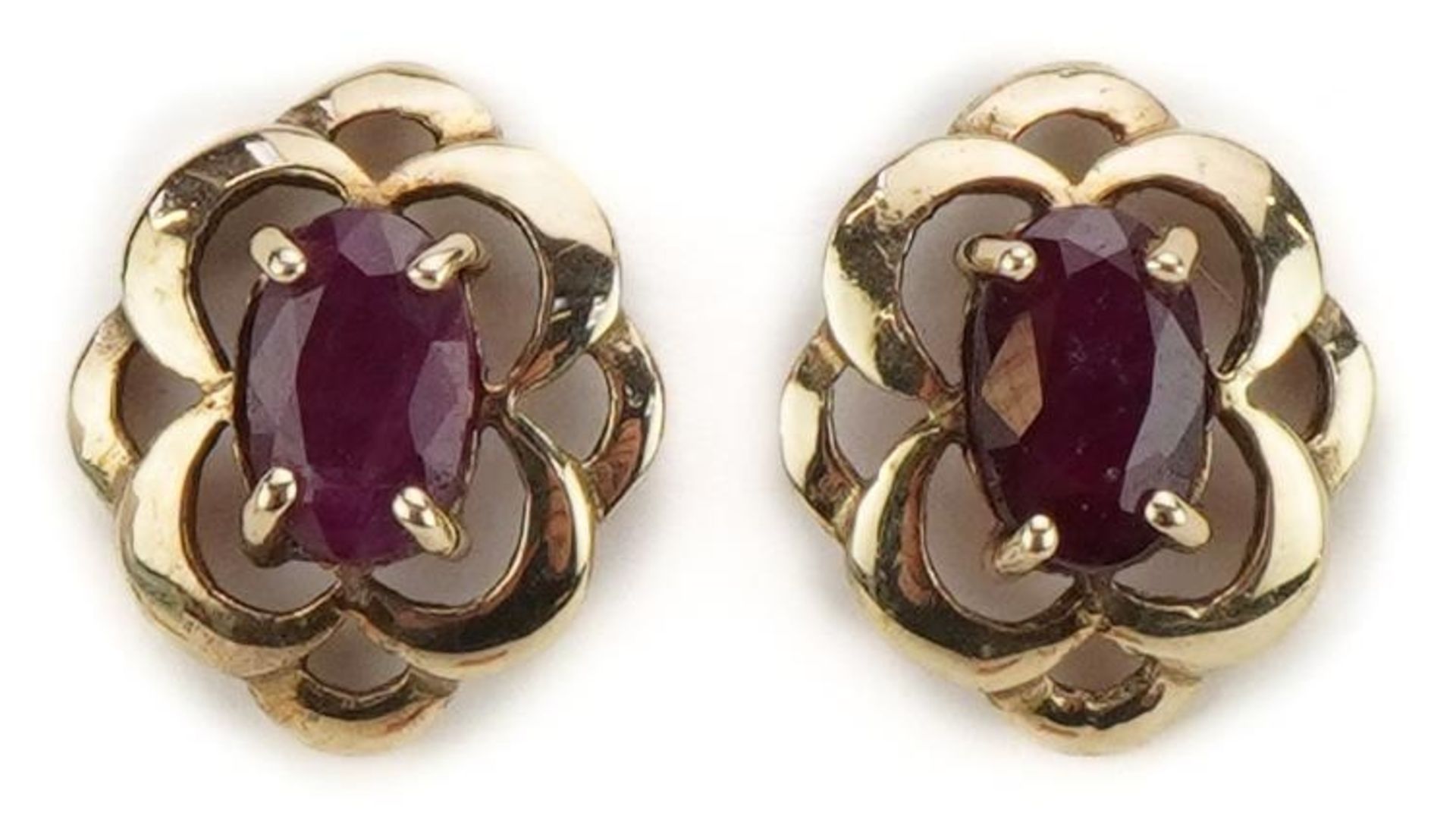 Pair of unmarked gold ruby stud earrings, the butterflies marked 9ct, 1.1cm high, 1.1g