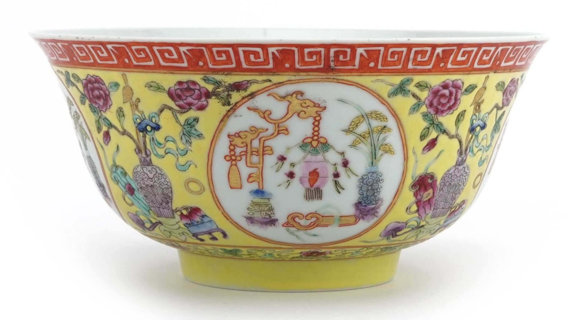 Chinese porcelain yellow ground bowl hand painted in the famille rose palette with panels of lucky