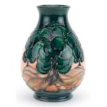 Moorcroft pottery baluster vase hand painted in the Mamoura pattern, 19cm high