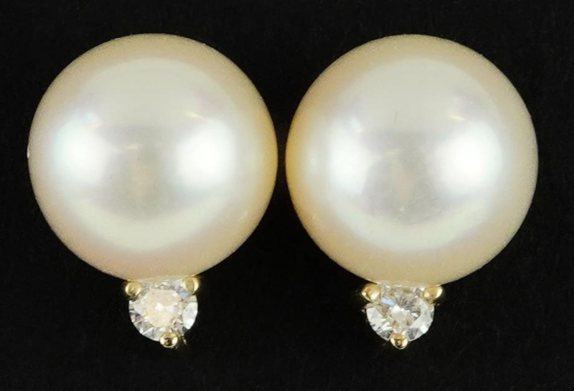 Pair of 9ct gold cultured pearl and diamond stud earrings, 1.1cm high, 2.7g