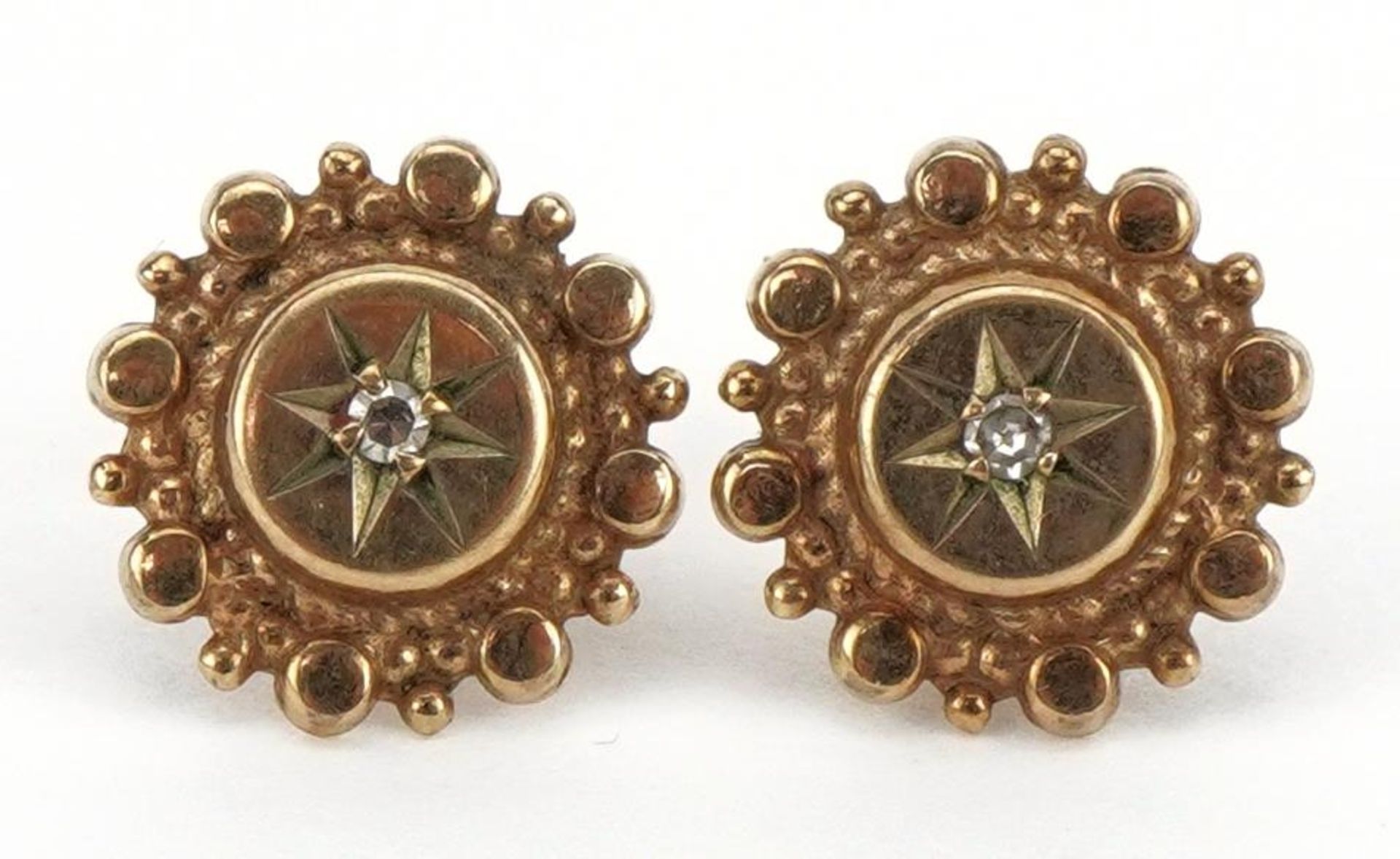 Pair of Victorian unmarked gold aesthetic diamond stud earrings, 1.0cm in diameter, 1.4g