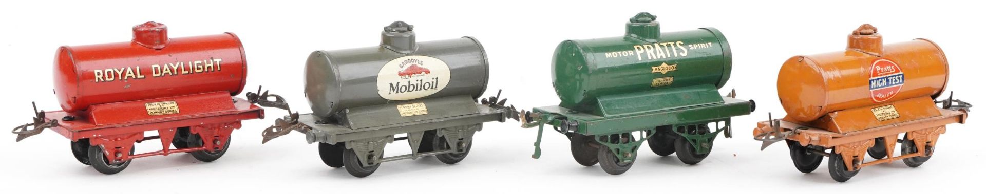 Four Hornby O gauge tinplate model railway advertising tankers comprising Pratt's Motor Spirit,