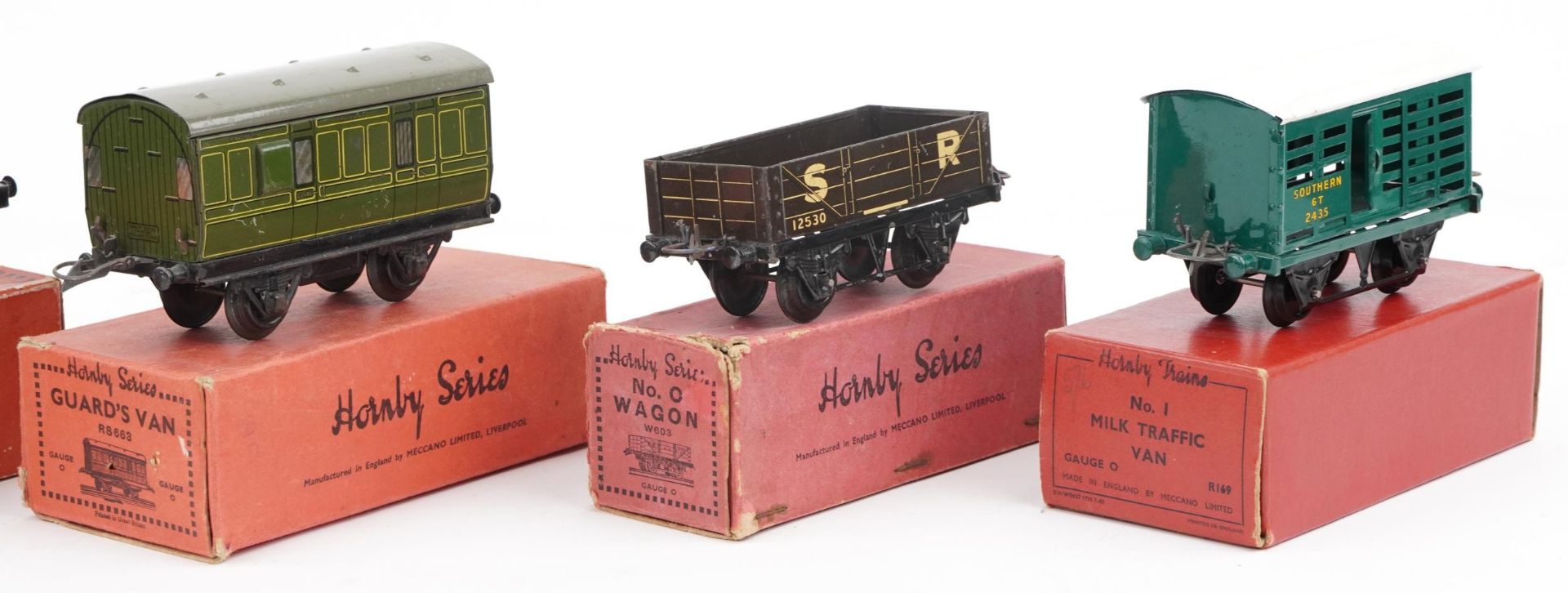 Five Hornby O gauge tinplate model railway wagons with boxes comprising passenger coach guards - Image 3 of 5