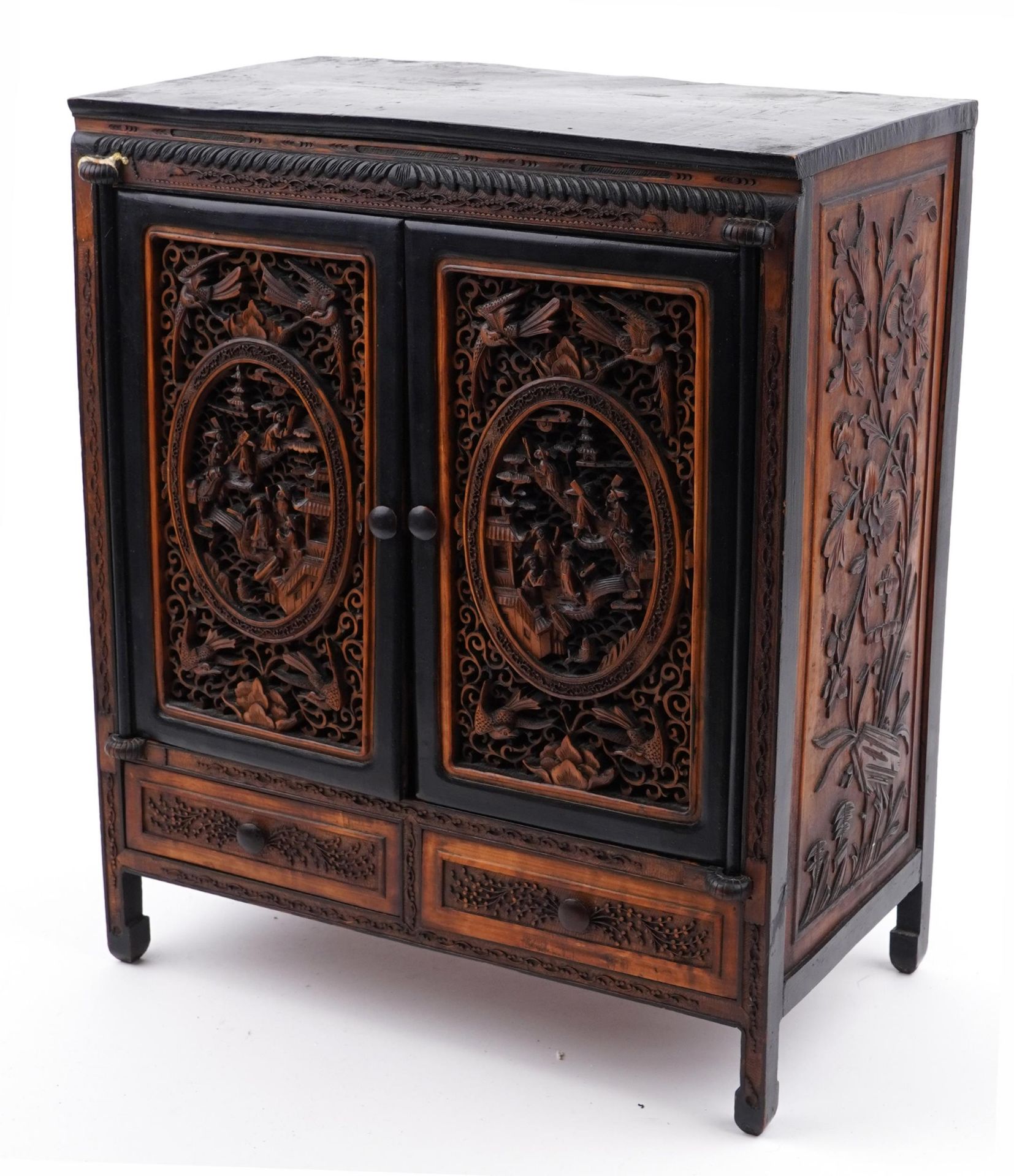 Chinese table cabinet with pair of doors enclosing eight drawers, finely carved and pierced with