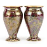 Daisy Makeig-Jones for Wedgwood, pair of Fairyland lustre baluster vases decorated with Firbolgs