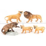 Five Beswick animals comprising mountain lion, lion & lioness and two lion cubs, the largest 23cm in