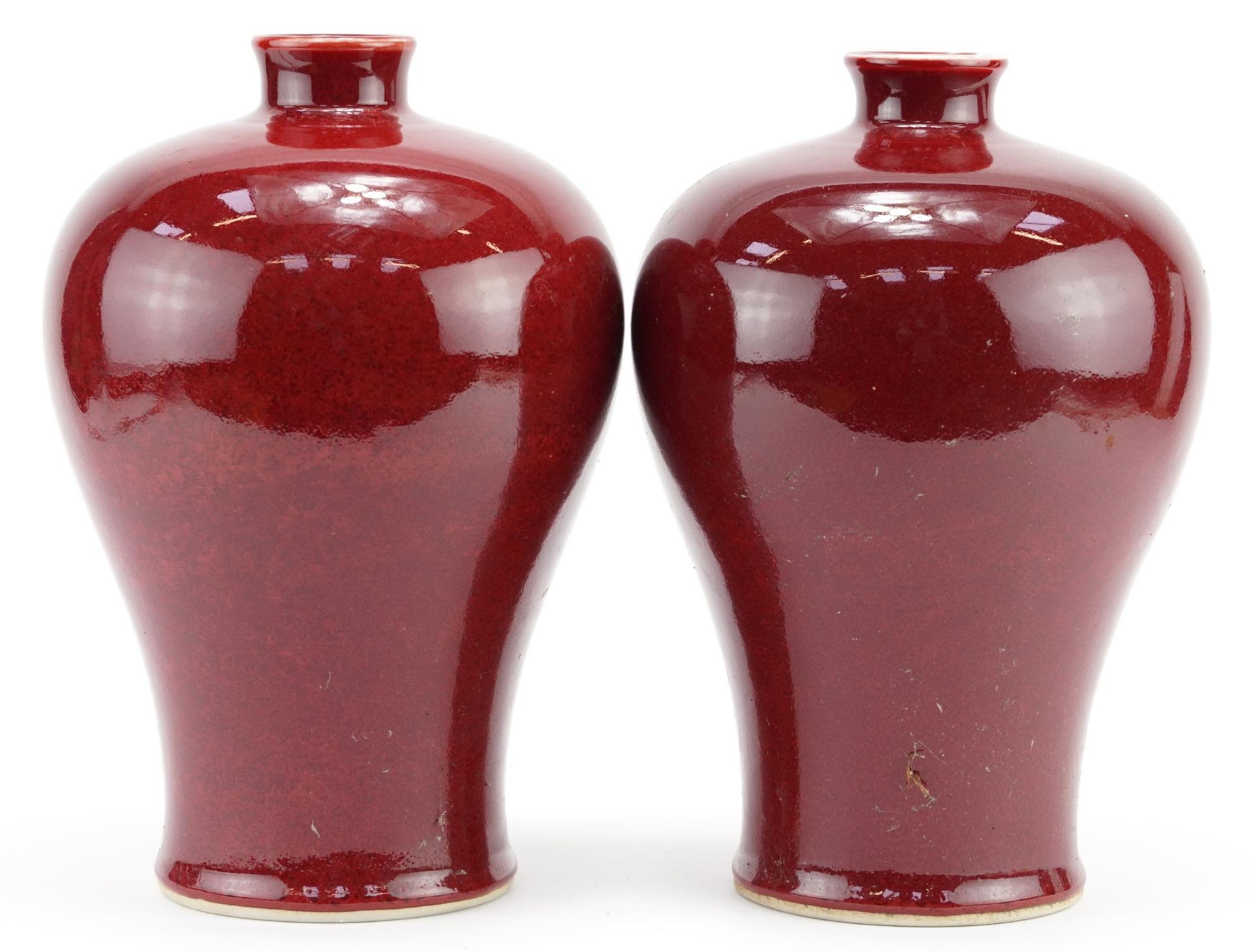 Pair of Chinese porcelain baluster vases having sang de boeuf glazes, each 29cm high