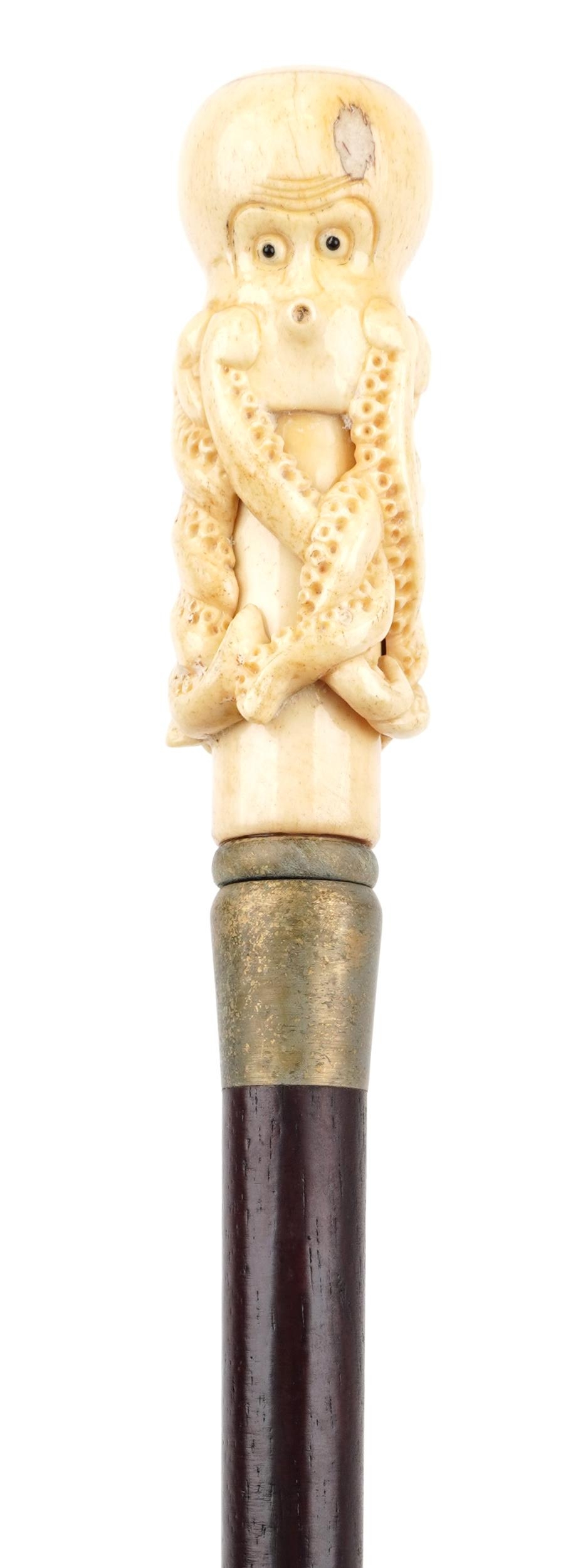 Hardwood walking stick with carved bone handle in the form of an octopus, 90.5cm in length