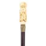 Hardwood walking stick with carved bone handle in the form of an octopus, 90.5cm in length