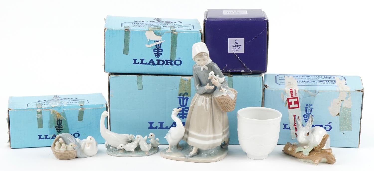 Four Lladro porcelain animals, figures and a bell with boxes, the largest 22cm high